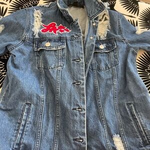 Distressed Jean jacket. L A. Squad.